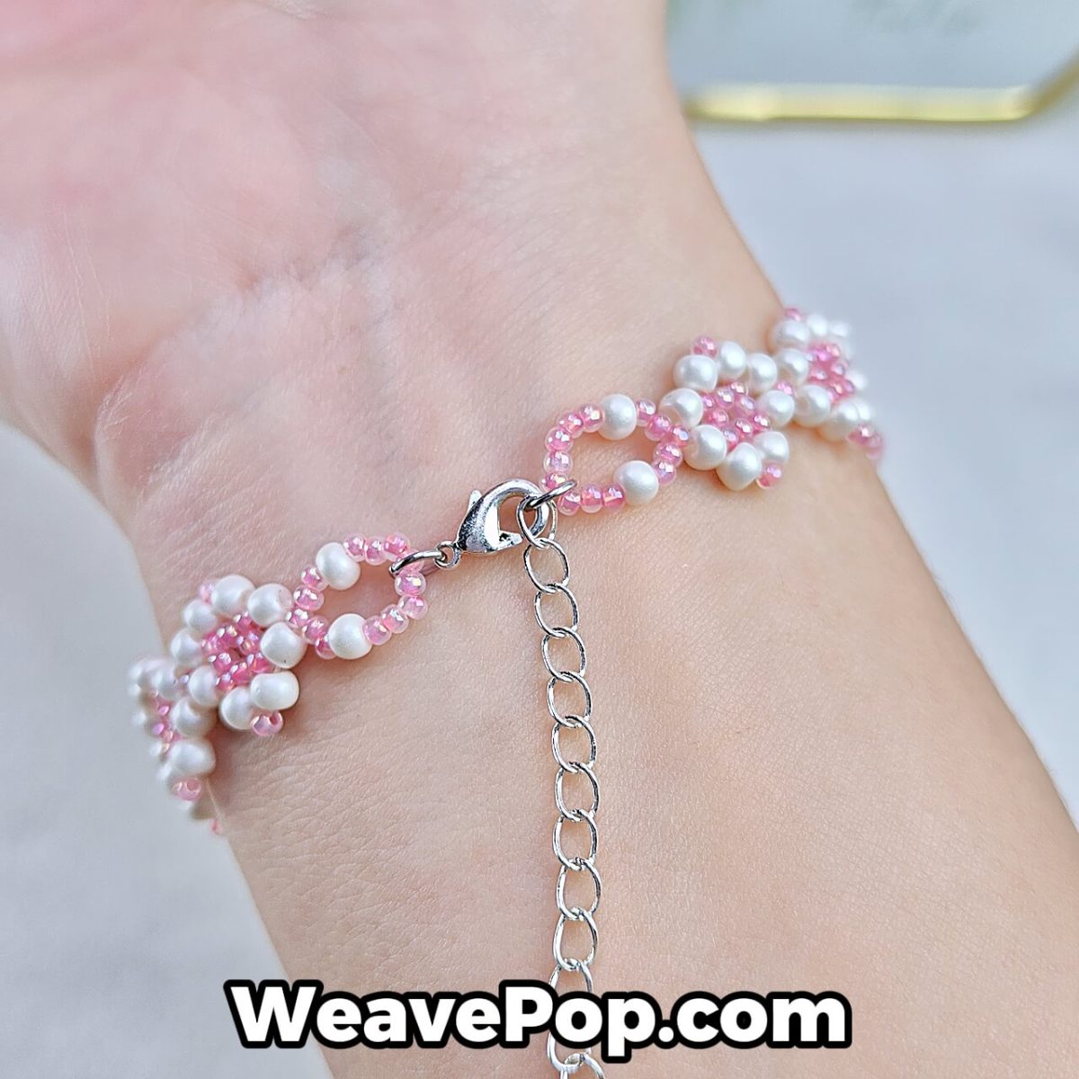 elegant pink seed bead bracelet worn on wrist – floral beading design