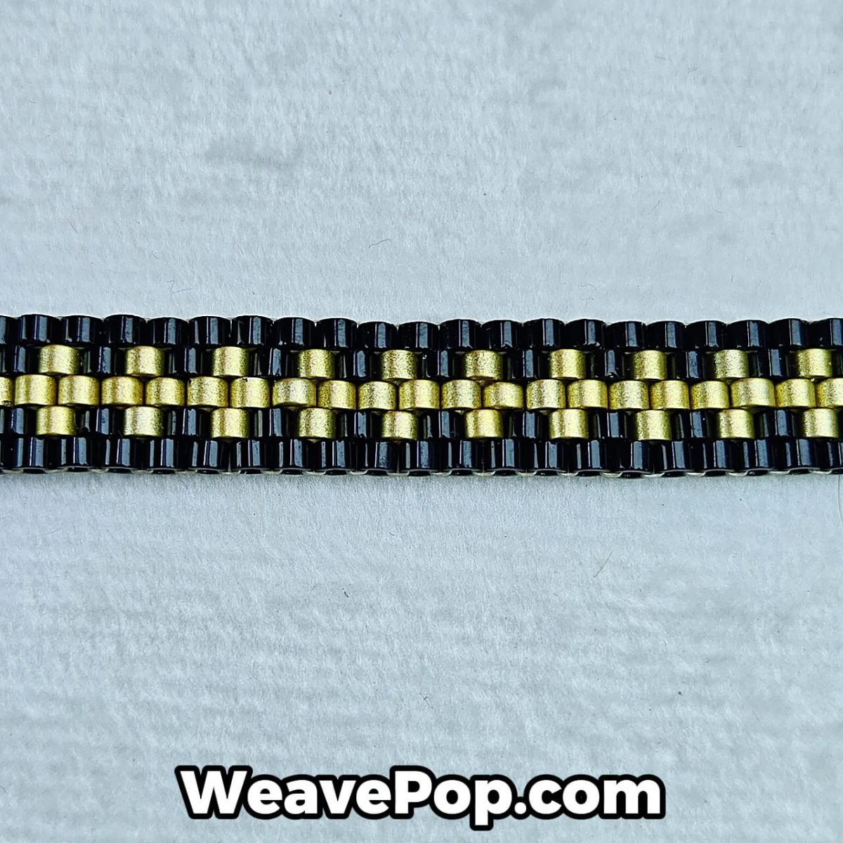 close-up of black and gold seed bead weaving pattern – bracelet detail B035
