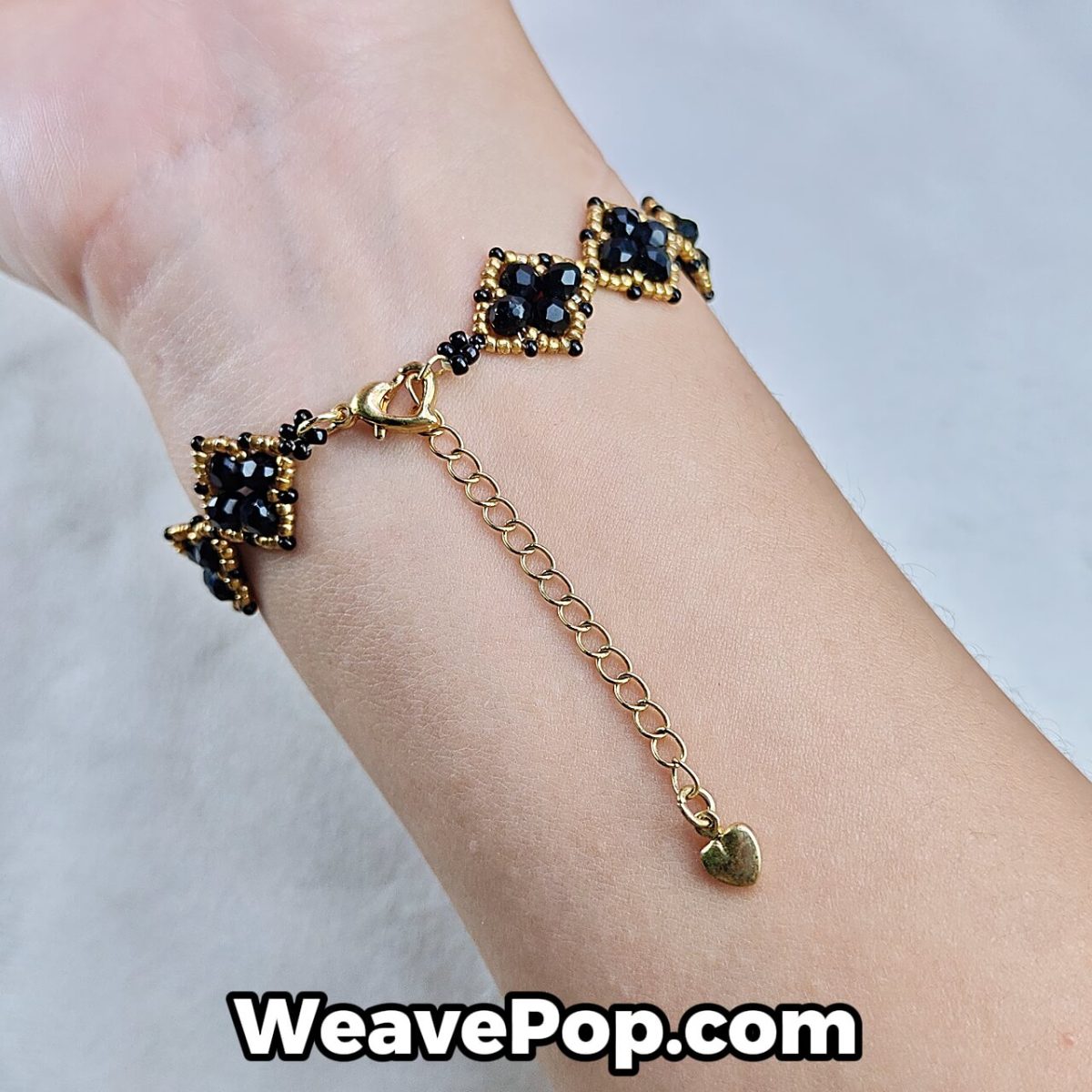 beaded bracelet B042 black gold square style shown on hand