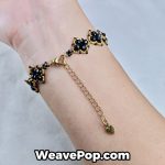 beaded bracelet B042 black gold square style shown on hand