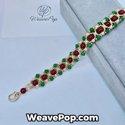 Red–Green Classic bead bracelet materials from kit B050 displayed flat