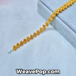B054 amber yellow bicone bead bracelet flat lay