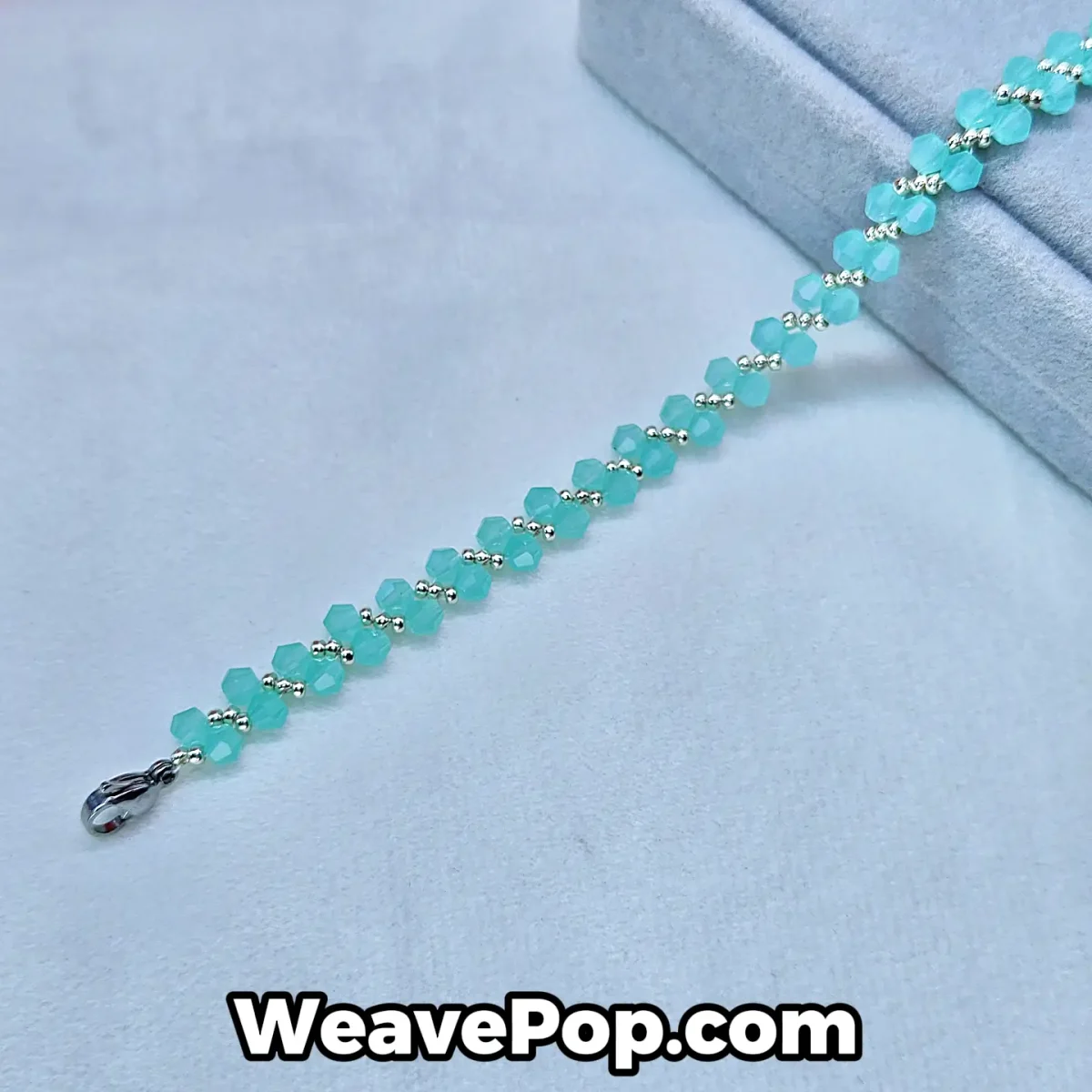 B054 lake blue bicone bead bracelet flat lay
