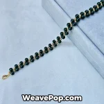B054 dark green bicone bead bracelet flat lay