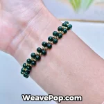 B054 dark green bead bracelet worn on wrist