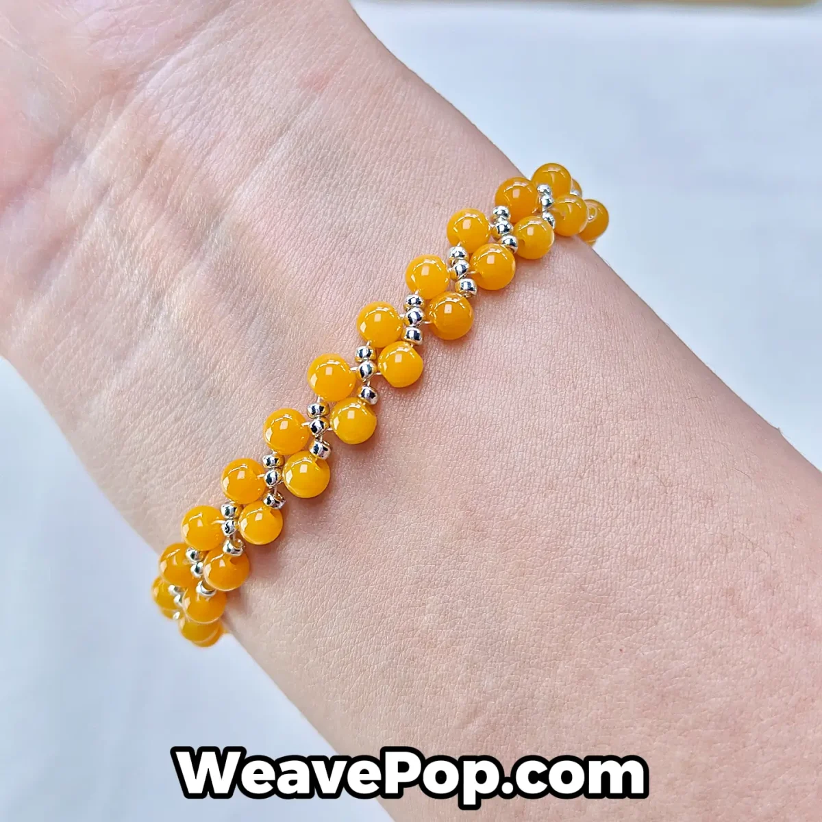 B054 amber yellow bead bracelet worn on wrist