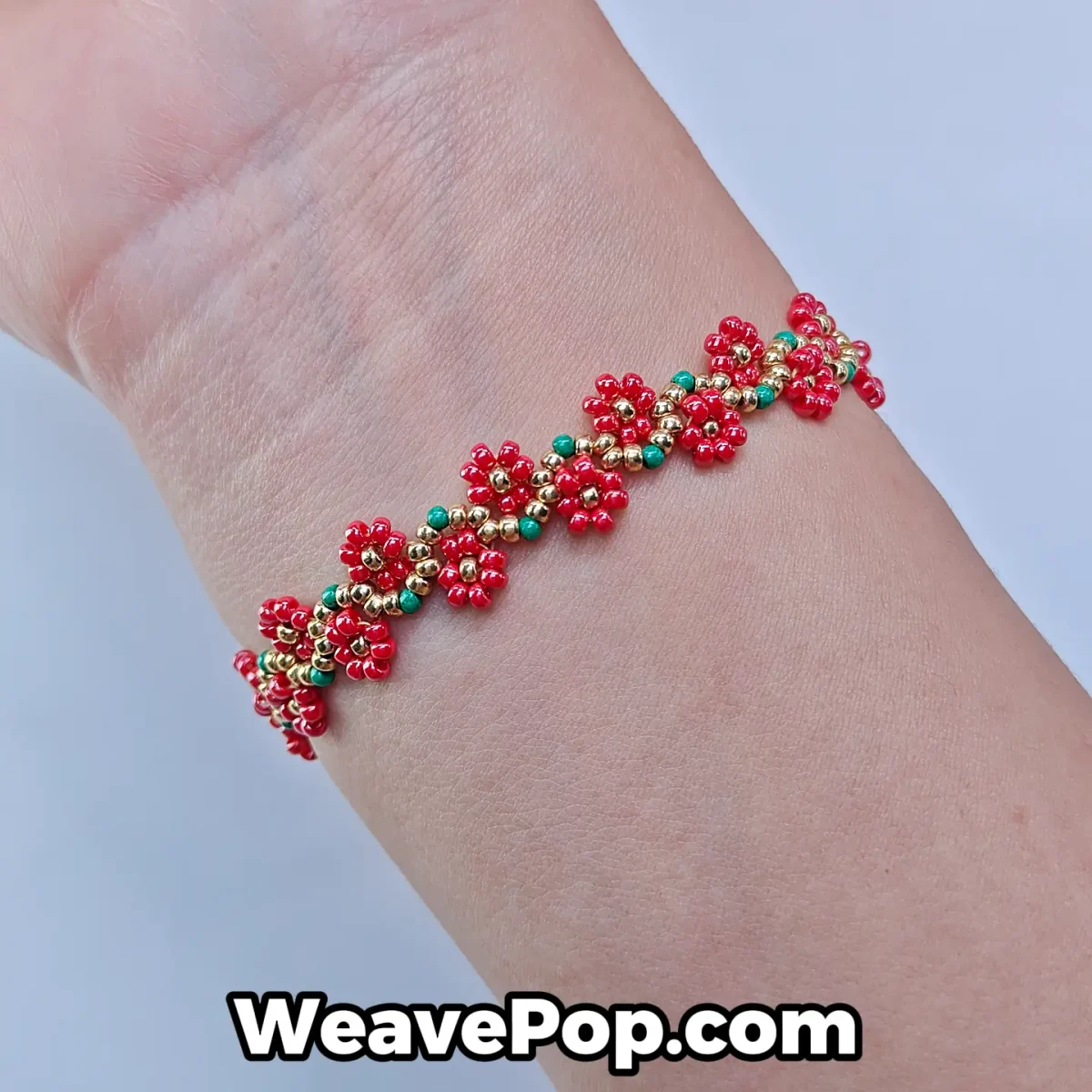 Red beaded flower bracelet from bead bracelet kit B056 worn on wrist