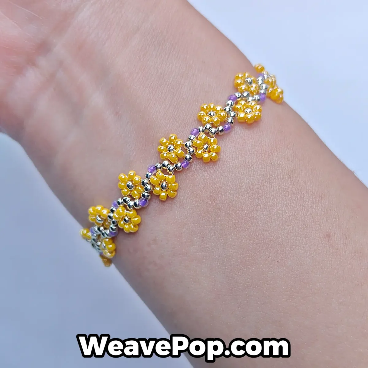 Yellow beaded flower bracelet from bead bracelet kit B056 worn on wrist
