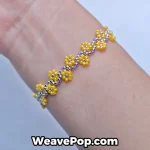 Yellow beaded flower bracelet from bead bracelet kit B056 worn on wrist