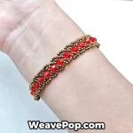 Red beaded bracelet worn on wrist