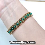 Green beaded bracelet worn on wrist