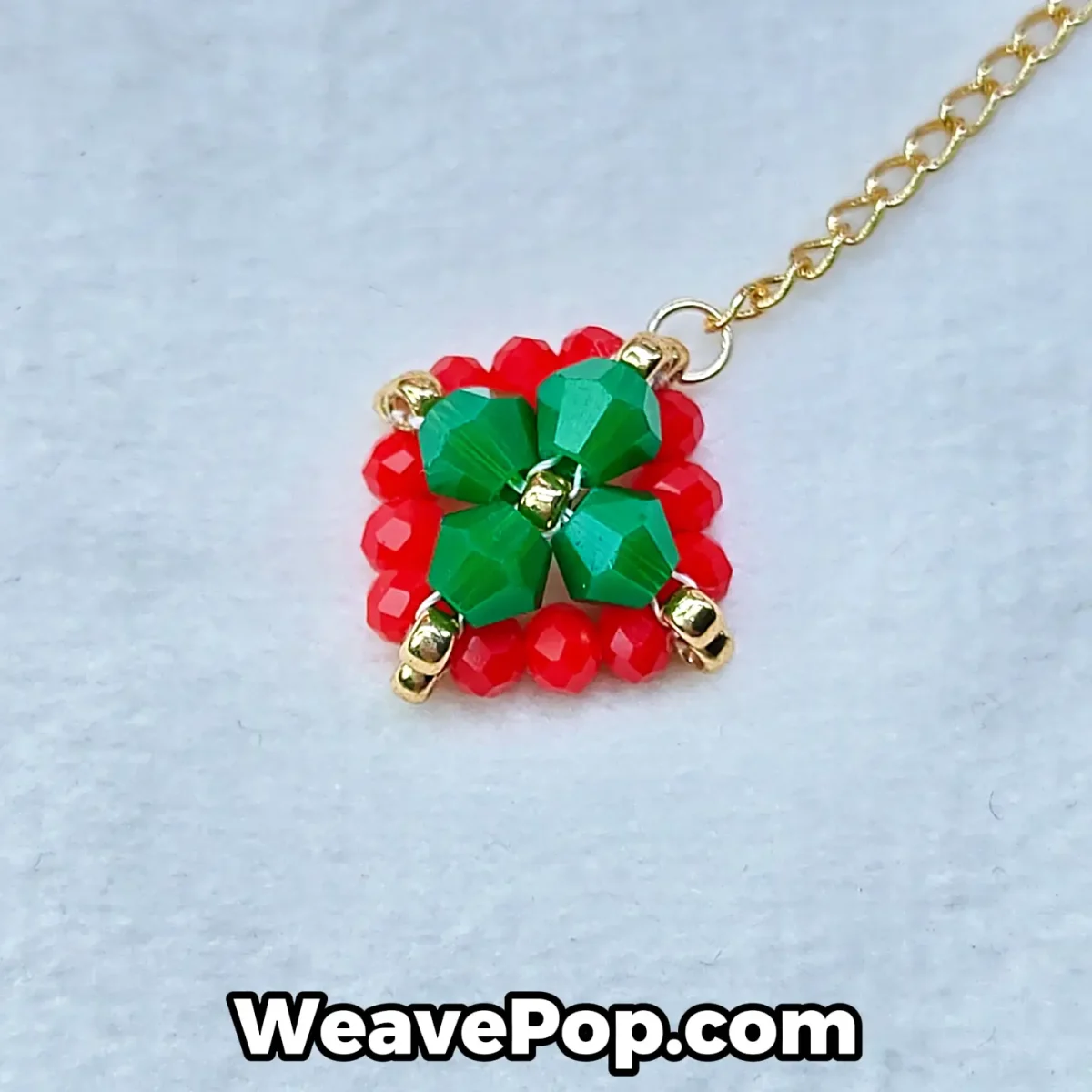 Close-up detail of red and green beaded Christmas earrings – E005