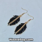 black feather seed bead earrings flat lay e006