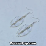 white feather seed bead earrings flat lay e006