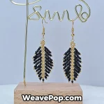 black feather beaded earrings hanging display e006