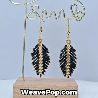black feather beaded earrings hanging display e006