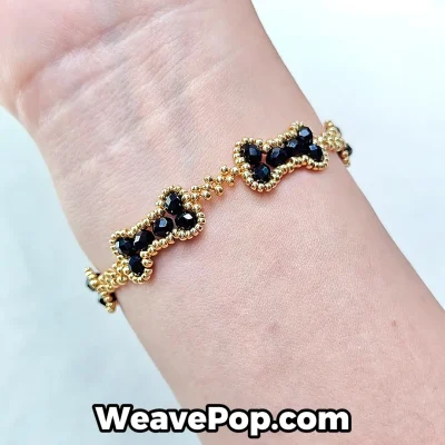 bone link bead bracelet worn on wrist with structured repeating design