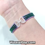 Purple edge and emerald center striped beaded bracelet worn on wrist layered look B063