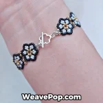 Delicate flower bead bracelet shown on wrist B064