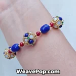 Dark blue wide woven beaded cuff bracelet worn on wrist B065