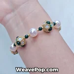 Dark Green wide woven beaded cuff bracelet worn on wrist B065