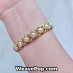 Gold pearl beaded bracelet worn on wrist B066