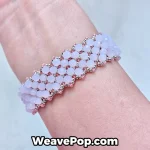 pink wide bead bracelet worn on wrist – woven bead design B067