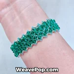 green wide bead bracelet worn on wrist – advanced woven design B067