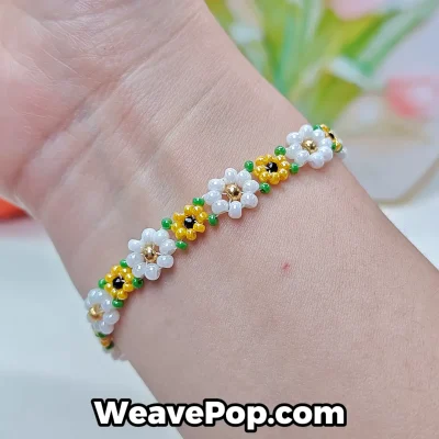 Daisy flower beaded bracelet worn on wrist