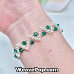 Cross pearl bracelet worn on wrist – dark green