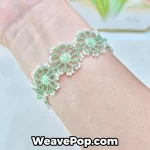 green beaded flower bracelet on wrist