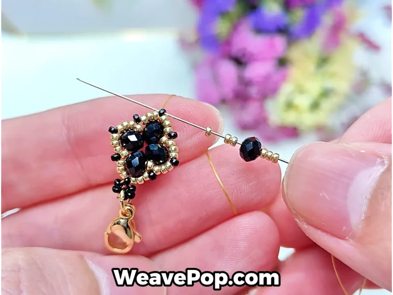flower bead bracelet tutorial step 11 passing through the top black bead and adding gold seed beads with a flat bead to form the next unit