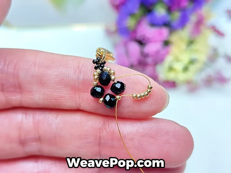 flower bead bracelet tutorial step 6 adding gold seed beads and passing through the next bead to continue the pattern