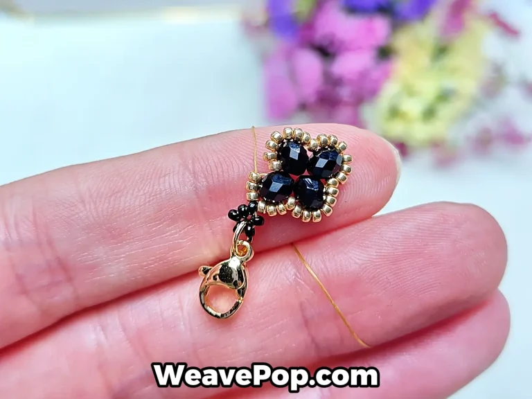 flower bead bracelet tutorial step 8 passing the thread through gold seed beads while skipping the middle black bead