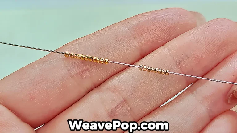 Close-up of beading needle showing regular glass beads (left) and precisely aligned Miyuki beads (right).