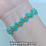 Woman wearing a dainty cyan floral Miyuki bracelet for a summer beach look