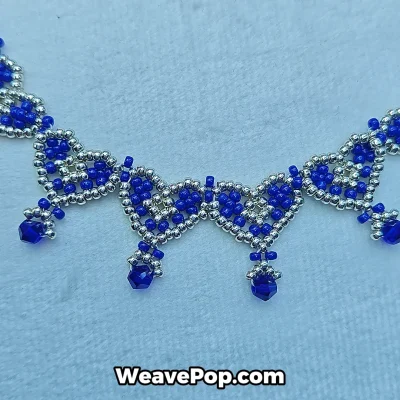 Close up of beading pattern showing beaded necklace crystal details