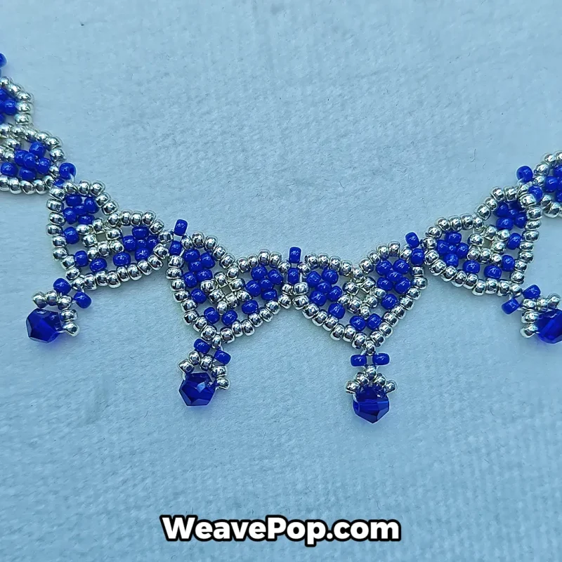 Close up of beading pattern showing beaded necklace crystal details