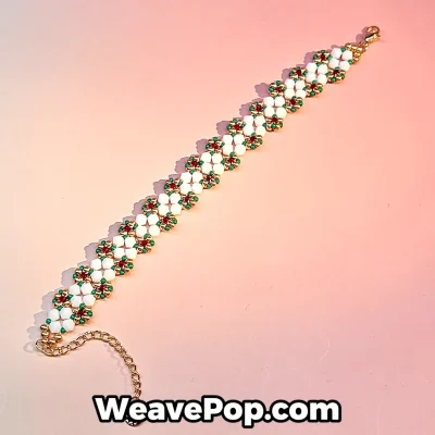 Daisy flower beaded bracelet kit featuring white floral motifs with red green and gold bead accents
