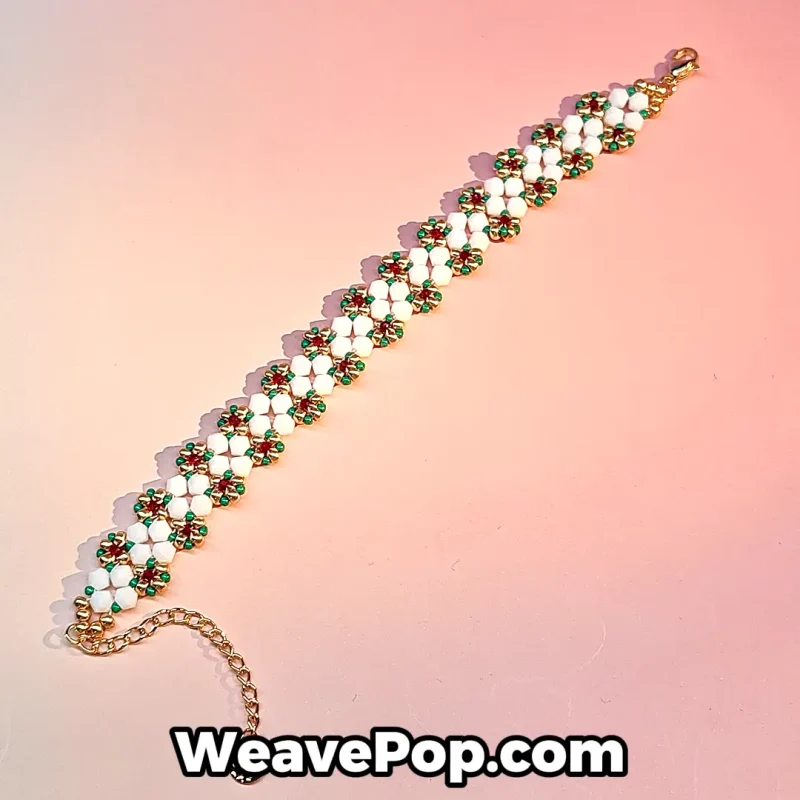 Daisy flower beaded bracelet kit featuring white floral motifs with red green and gold bead accents