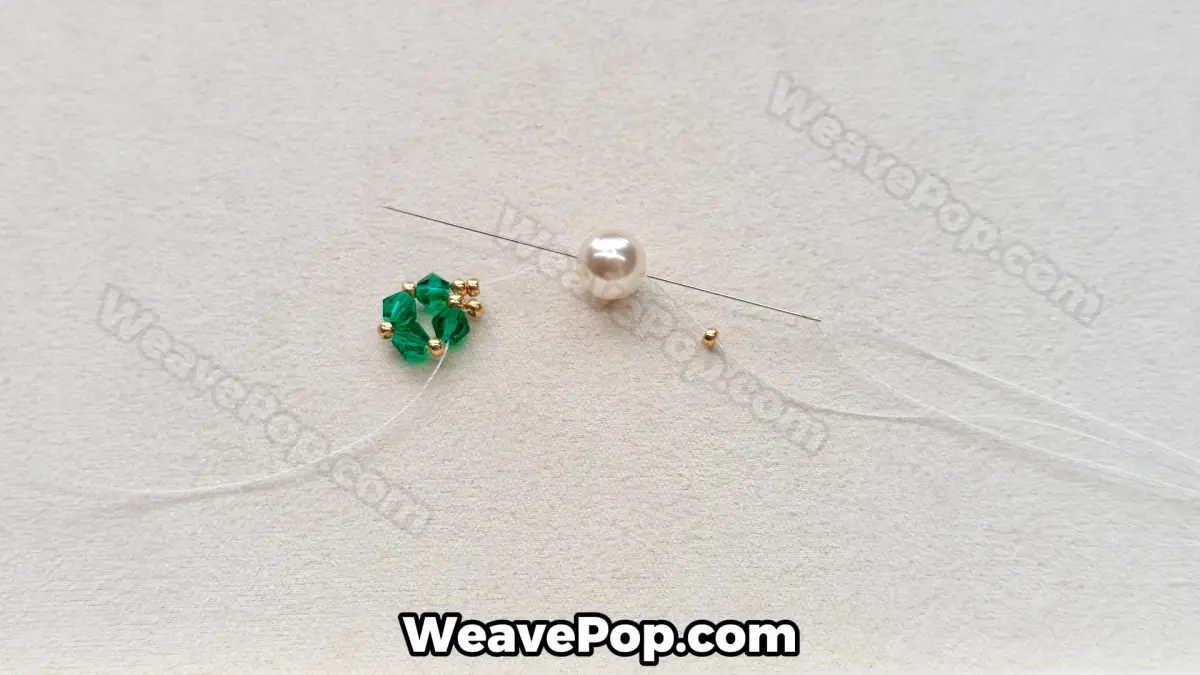 Step 10 of this seed bead necklace beading pattern - Securing the pearl