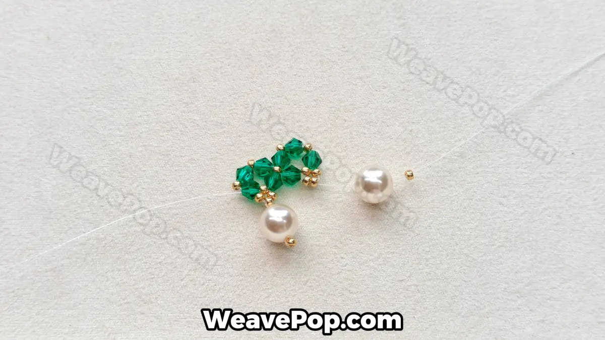 Step 18 of this seed bead necklace beading pattern - Adding the second pearl
