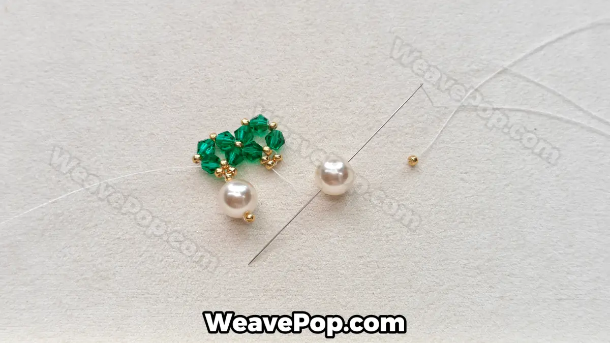 Step 19 of this seed bead necklace beading pattern - Securing the second pearl