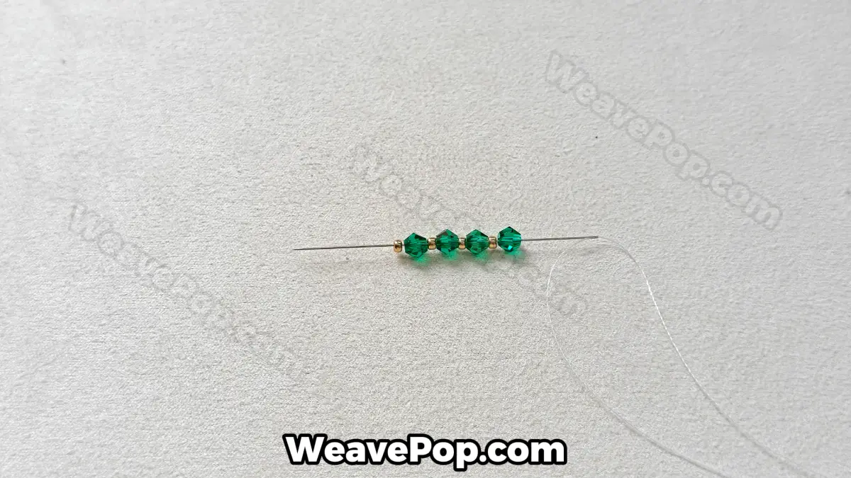Step 2 of this seed bead necklace beading pattern - Stringing crystals