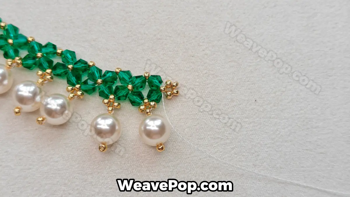 Step 24 of this seed bead necklace beading pattern - Reinforcing end beads
