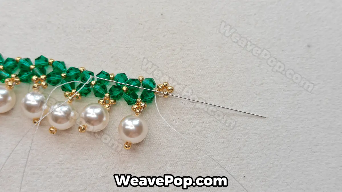 Step 25 of this seed bead necklace beading pattern - Weaving in thread