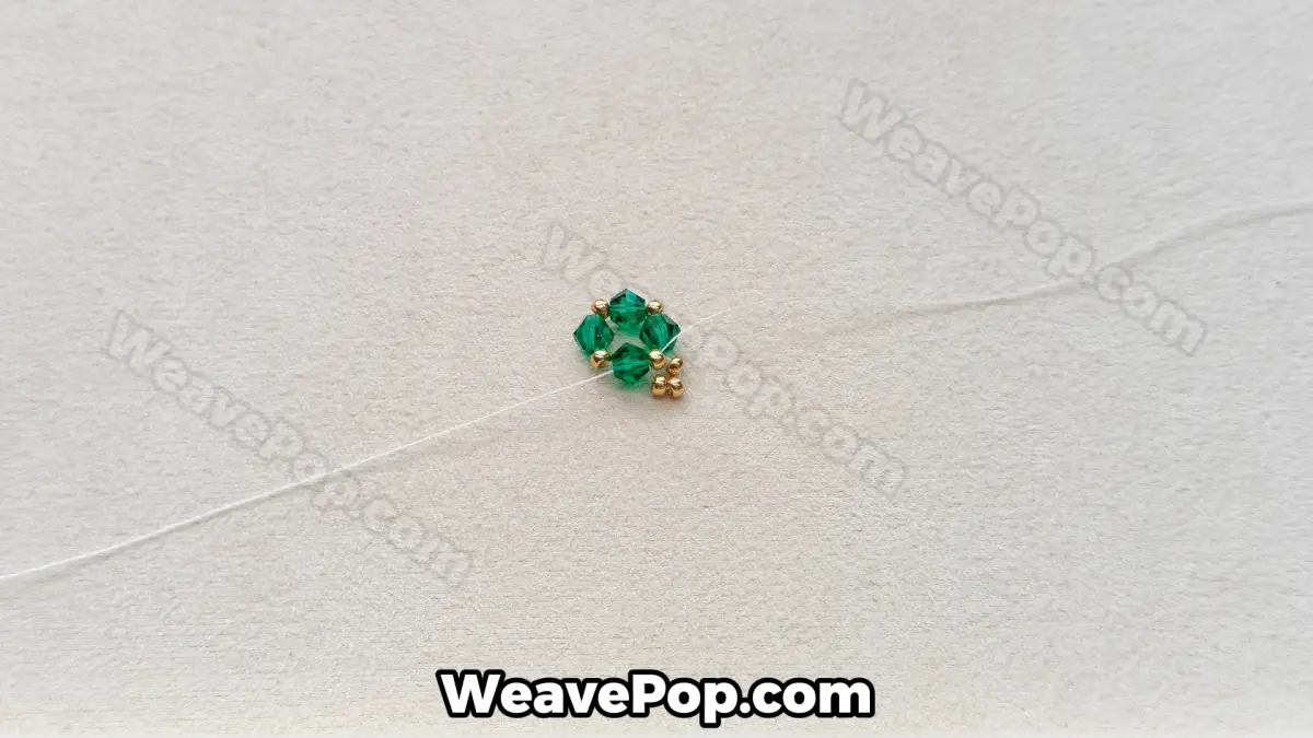 Step 6 of this seed bead necklace beading pattern - Adding gold accents
