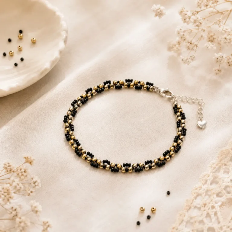 Gold and black spiral weave bracelet clasped in a circle showcasing the full design — B082 WeavePop