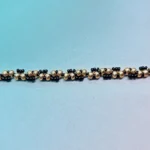 Close-up detail of Miyuki gold and black seed beads in twisted spiral weave pattern — B082 Bracelet Kit