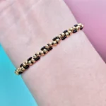 Handcrafted gold and black twisted bead bracelet worn on wrist — B082 Bead Bracelet Kit by WeavePop